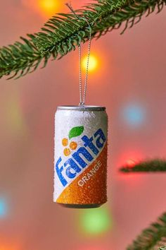 a can ornament hanging from a christmas tree