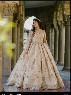 a woman in a wedding dress is posing for the camera