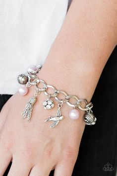 Pink pearls, ornate silver beads, and white rhinestone encrusted accents swing from a dramatic silver chain. A shimmery silver bird charm and silver tassel are added to the display, creating a whimsical fringe around the wrist. Features an adjustable clasp closure. Dove Bracelet, Pink Charm Bracelet, Pink Charm, Pink Jewels, Silver Bird, Pink Pearls, Bird Charm, Paparazzi Accessories, Blue Gems