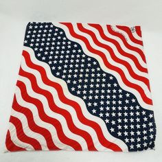 a red, white and blue american flag bandana on a white background with stars