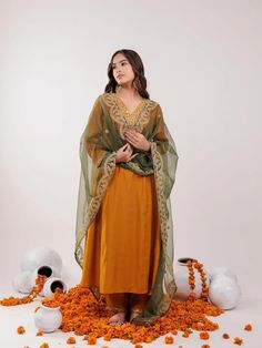 Product Details  Mustard Dori_Embroidery Silk Blend A-Line Kurta And Trouser with dupatta Set  Kurta design:- Bandhani Dori_Embroidery A-Line shape V-Neck, Three quarter sleeve Calf Length with Cotton Have a Lining Kurta Flared hem, Trouser design:- Solid one pocket Trouser Elasticated waistband Slip-on closure Material & Care- Top Fabric Silk Blend Bottom Fabric Silk Blend Dupatta Fabric Silk chiffon Shipping Policy Domestic delivery time is approximately 3 to 5 days. International delivery time is approximately 10 to 15 days. Return & Exchange GUIDELINES FOR A VALID RETURN AND EXCHANGE: All product tags intact and in their original packaging Product must be unused Products must be in an unwashed and in undamaged condition Whenever you return a product make sure you take a receipt. For fu Orange Semi-stitched Palazzo Set For Navratri, Orange Palazzo Saree Set For Diwali, Festive Semi-stitched Palazzo Set In Orange, Festive Semi-stitched Orange Palazzo Set, Chanderi Palazzo Set With Traditional Drape For Diwali, Festive Orange Semi-stitched Palazzo Set, Bollywood Style Orange Palazzo Set For Festive Occasion, Bollywood Style Orange Palazzo Set For Festive Season, Festive Orange Palazzo Set With Straight Kurta