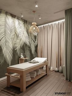 a spa room with a wooden table and white towels on it