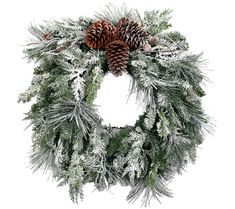 a christmas wreath with pine cones and snow