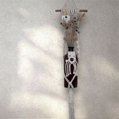 a decorative item hanging on the side of a wall