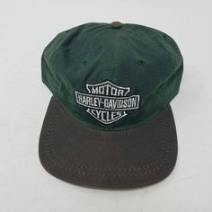 Vintage Harley Daviddson Motorcycles Waxed Strapback Hat. I Believe This Hat To Be New/Unworn And A Rare Hat As I Cannot Find Another One Like It. No Manufacturer Warranty Implied Or Given Vintage Leather Hats For Outdoors, Classic Green Baseball Cap For Outdoor, Classic Outdoor Waxed Finish Hats, Classic Adjustable Hat With Waxed Finish, Classic Brown Trucker Hat For Outdoor, Classic Outdoor Trucker Hat With Short Brim, Vintage Cap With Leather Patch, Classic Snapback Hat With Flat Bill For Outdoor, Vintage Outdoor Hat With Leather Patch