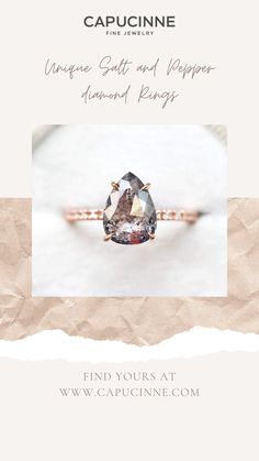 an engagement ring with a pear shaped diamond on it and the words, unique wedding rings and