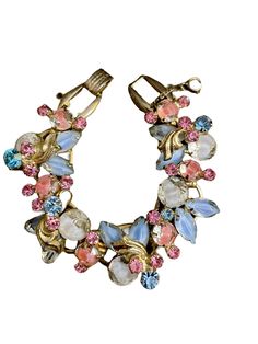 Here for your consideration is a vintage Juliana D&E pink, blue, and white Givre glass rhinestone bracelet. It's a really beautiful piece with a safety chain. Measures 7" long.  Very good condition for its age though it does have a bit of wear to the back portion. I have factored this into my price for the piece. See images please. Thank you. Sparkling Crystal Bracelet In Costume Jewelry Style, Vintage Crystal Bracelets With Jewels, Vintage Jeweled Crystal Bracelets, Safety Chain, Marine Biology, Rhinestone Bracelet, See Images, Chain Link Bracelet, Biology