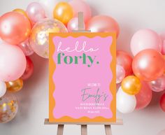 there is a sign that says hello forty on it next to balloons and streamers