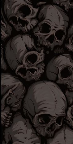 a bunch of skulls that are in the darkroom, with one skull on it's side