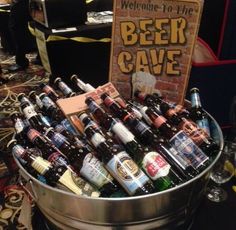 a bucket full of beer sitting on top of a table