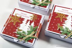 three boxes that have christmas decorations on them