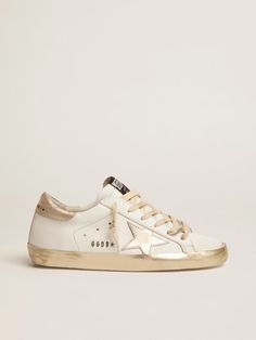 Women’s Super-Star sneakers with gold foxing | Golden Goose Gold Sneakers With Metallic Logo For Streetwear, Gold Low-top Sneakers With Metallic Logo, Gold Sneakers With Foil Embossed Logo And Round Toe, Gold Casual Sneakers With Metallic Logo, Gold Luxury Sneakers With Metallic Logo, Casual Gold Sneakers With Metallic Logo, Luxury Gold Sneakers With Metallic Logo, Golden Goose Women, White And Gold Sneakers