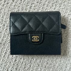 Brand New Chanel Tri Fold Wallet Plastic And Encasing Still Intact Includes Box, Case, Receipt, Authentication Cards / Full Set No Flaws/No Wear/Never Used Dimensions: 4.5"W X 4"H X 1"D Comes From A Smoke/Pet Free Environment. No Trades. Please Ask All Questions Before Purchasing. Thanks. Black Compact Luxury Bag, Luxury Black Compact Bag, Luxury Compact Black Bag, Luxury Black Wallets For Daily Use, Black Luxury Rectangular Wallet, Designer Compact Coin Purse For Travel, Classic Black Coin Purse, Luxury Bifold Coin Purse For Travel, Formal Black Coin Purse With Card Slots