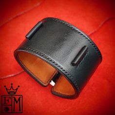 "This black leather cuff watchband uses the highest quality natural vegetable-tanned bridle leather and is hand stitched throughout. A soft calfskin lining hugs your wrist and a high quality roller buckle closes it up! I'll need your wrist size and watch size per the supplied pic. I Can size it for men or women Can be made many finishes and colors. Just ask! - 1-3/4\" wide - Hand saddle stitched - Vegetable tanned Bridle leather I can make most of my watchband styles to fit your Apple watch. Jus Timeless Leather Bracelet For Formal Occasions, Leather Cuff Wristband With Bracelet Strap, Luxury Leather Cuff Bracelets, Formal Leather Cuff Bracelets, Classic Handmade Leather Cuff Bracelet, Classic Leather Cuff Bracelet, Business Leather Bracelets With Leather Strap, Black Leather Cuff Bracelet For Formal Occasions, Luxury Leather Cuff Bracelet