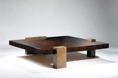 a wooden table sitting on top of a white floor