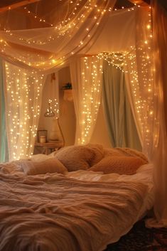 a bed with lights hanging from the ceiling and curtains over it's headboard