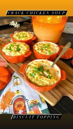 an orange bowl filled with food on top of a cutting board next to pumpkins