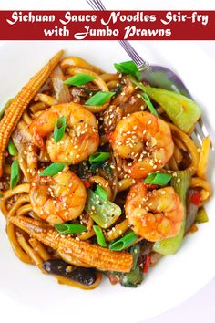 stir fry with shrimp, noodles and vegetables on a white plate topped with sesame seeds