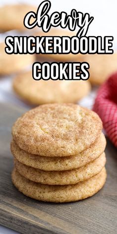 a stack of chewy snickkerdoodle cookies sitting on top of a wooden cutting board