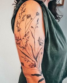 a woman with a tattoo on her arm