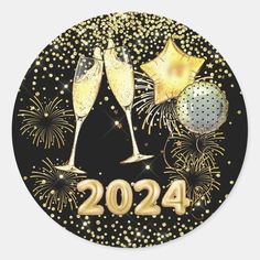 two champagne glasses with gold confetti and fireworks on black background round sticker