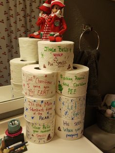 a stack of toilet paper sitting on top of a bathroom counter