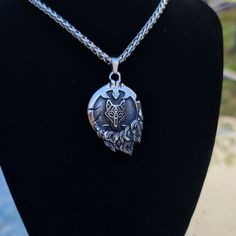 The Story Behind The Craftsmanship: This beautiful hand-crafted Viking necklace depicts the head of a wolf. Wolves had great importance to Viking / Norse mythology, and this bracelet is representative of the monstrous wolf Fenrir who battles and slays Odin during Ragnarok (the end of the world). This style necklace was actually worn by Viking people many centuries ago and is inspired by artifacts found on the Isle of Gotland (Sweden) and from dig sites in Iceland. This pendant will be designed u Collectible Viking Sterling Silver Jewelry, Fantasy Style Engraved Necklaces For Gifts, Fantasy Style Engraved Necklace For Gift, Fantasy Style Engraved Jewelry As Gift, Fantasy Engraved Jewelry As Gift, Fantasy Style Engraved Jewelry Gift, Unique Collectible Stainless Steel Jewelry, Unique Engraved Stainless Steel Necklaces, Viking Style Wolf Design Jewelry Gift