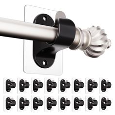 an image of a metal curtain rod with black and white clips on the back side