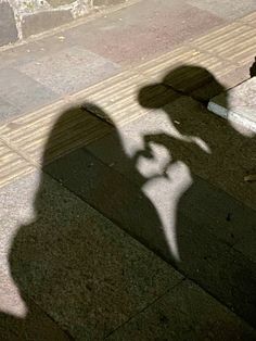 the shadow of a person riding a skateboard