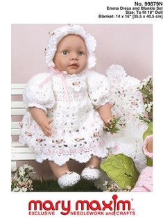 a baby doll sitting on top of a white bench next to some flowers and grass