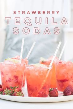 strawberry tequila sodas with strawberries on the side