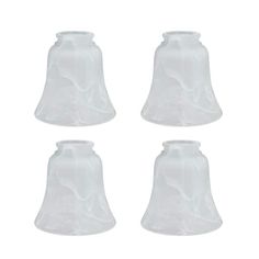 four white glass bells on a white background