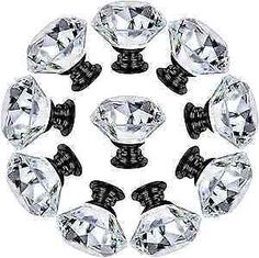 an assortment of crystal knobs on white background