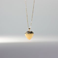 *CHAIN IS NOT INCLUDED. Own a tangible representation of love in the most elegant way. This 14K solid gold heart-shaped pendant is the most sophisticated way of showing love to someone who is dear to your heart. Whether that be yourself or a significant other. This gold heart locket pendant will captivate not only the eyes but also the heart of the person who will receive it. Made from the finest 14K solid gold material, this heart-shaped pendant is a real symbolism of luxury and of love. Make i Yellow Gold Open Heart Locket Necklace Keepsake, Heart Cut Locket Necklace With Heart Charm For Anniversary, Heart Cut Locket Necklace For Gift, Anniversary Heart Cut Locket Necklace With Heart Charm, Classic Yellow Gold Heart Necklace As Gift, Elegant Yellow Gold Locket Necklace For Anniversary, Classic Yellow Gold Heart Necklace For Gift, Anniversary Heart Necklace With Locket, Anniversary Heart Cut Locket Necklace