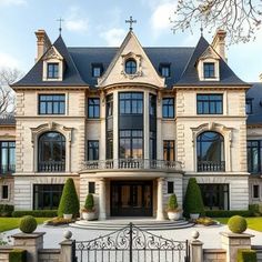 a large house with an iron gate in front of it