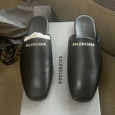 The Ultimate Balenciaga Slip-Ons! Brand New With Tags, Box, And Dust Bag Included 100% Authentic And Never Worn Crafted With Premium Leather For Timeless Style And Comfort Versatile Design, Perfect For Any Occasion Super Rare And Hard To Find! Fits Women’s Size 9.5 Or Men’s Size 8. Don’t Miss Out On This Amazing Find! Designer Flat Mules With Rubber Sole, Designer Flat Mules, Designer Black Slip-on Mules, Designer Slip-on Mules For Office, Designer Black Almond Toe Mules, Black Pointy Heels, Balenciaga Triple S White, Balenciaga Track Trainers, Balenciaga Track Sneaker