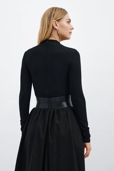 Our Ophelia Belt is a match made for all the garments in your closet. Handcrafted from luxe Italian leather, geometric seam details sculpt the form of the belt and add shape to the waistline. Ophelia's contrast zipper front-and-center makes for eye-catching edge, while an understated elastic panel at the back provides a comfortable stretch fit. Add Ophelia to your dresses, jumpsuits, tunics and beyond...you'll find so many ways to style her. | Maritza Large Belt Outfit, Black Fitted Belt For Night Out, Modern Fitted Corset Belt For Party, Luxury Corset Belt, Luxury Fitted Corset Belt, Chic Fitted Leather Corset Belt, Fitted Corset Belt For Night Out, Modern Fitted Corset Belt With Belt Loops, Elegant Fitted Corset Belt For Workwear