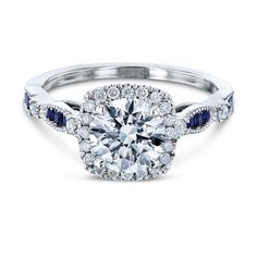 a cushion cut diamond and blue sapphire engagement ring