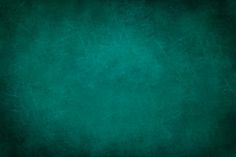 a dark green background with some stains on the bottom and top corner, as well as an area for text or image