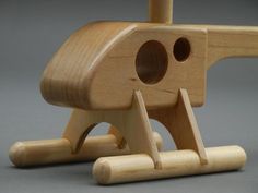 a wooden toy that is shaped like a dog