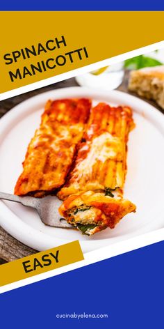 a white plate topped with lasagna covered in cheese