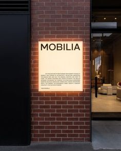 a sign on the side of a building that says mobbilla