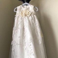 FREE SHIPPING IN U.S. Convert your gorgeous wedding dress into a beautiful heirloom Christening/Baptism/Blessing gown. Price is determined by style of dress, starting at $180.00. Made heirloom quality, French seams, bridal looping and buttons from your dress, or I will furnish. Hand finished, no visible raw seams. I named this dress Alisse. Please email me a picture of your dress with a description of the baby dress you want and I will provide a price. If you need to have the balance of your dre Cream Sleeveless First Communion Dress For Wedding, First Communion Ball Gown With Lace Bodice For Baptism, White Elegant Baptism Dress For Church, Elegant Cream Baptism Dress For Church, Lace Bodice Ball Gown For Baptism And First Communion, Lace Bodice Ball Gown For First Communion, Sleeveless White Baptism Gown, Elegant Sleeveless Baptism Dress For First Communion, White Sleeveless Baptism Dress For Wedding