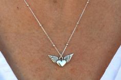 "Introducing our Guardian Angel Wings Necklace, a 925  sterling silver masterpiece that combines elegance and protection. Handmade with precision, this necklace features intricately detailed angel wings, serving as a beautiful reminder that you are never alone. Perfect for women who appreciate meaningful jewelry, this piece adds style and significance to any outfit.  Whether for special occasions or daily wear, our Guardian Angel Wings Necklace is a timeless symbol of protection and love, ensuri Sterling Silver Angel Wings Jewelry For Anniversary, Elegant Silver Jewelry With Angel Wings, Elegant Nickel-free Wing-shaped Jewelry, Elegant Silver Angel Wings Jewelry, Silver Angel Wings Jewelry For Gift, Wing-shaped Sterling Silver Necklaces For Anniversary, Sterling Silver Wing-shaped Necklaces For Anniversary, Silver Angel Wings Jewelry Gift, Sterling Silver Wing-shaped Necklace For Anniversary