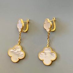 Handcrafted earrings, 18k gold plated over sterling silver, mother of pearl clovers. Timeless, feminine and chic. Wear them day or night casual or dressed up. Mother of pearl clovers Made with love in Los Angeles Complimentary gift wrapping provided All sales final. Luxury Mother Of Pearl Drop Earrings, Luxury Gold Pearl Earrings In Mother Of Pearl, Luxury Gold Plated White Pearl Earrings, Luxury White Pearl Gold-plated Earrings, Luxury Gold Mother Of Pearl Earrings, Luxury White Gold Plated Pearl Earrings, Luxury Mother Of Pearl Earrings As Gift, Luxury Mother Of Pearl Earrings For Gift, Clover Earrings