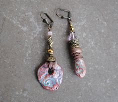 A pair of OOAK Asymmetrical rustic organic earrings. About 6 cm. Copper Brass Artisan beads Wood Sari silk * The artisan beads are created of extra lightweight and durable clay For more Bohemian jewelry, please visit my shop :) https://www.etsy.com/shop/IsadorasDream Bohemian Drop Earrings With Unique Variations, Rustic Dangle Earrings As A Gift, Rustic Dangle Earrings For Gift, Rustic Drop Earrings With Ear Wire, Earthy Handmade Multicolor Earrings, Multicolor Earthy Dangle Earrings, Bohemian Multicolor Wooden Bead Earrings, Artisan Multicolor Brass Earrings, Bohemian Multicolor Hand-strung Earrings