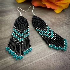 Southwestern inspired beaded fringe earrings made with miyuki seed beads. Southwestern Fringe Earrings With Round Beads, Southwestern Beaded Fringe Dangle Earrings, Southwestern Style Beaded Fringe Dangle Earrings, Southwestern Adjustable Beaded Fringe Earrings, Southwestern Fringe Beaded Earrings As Gift, Southwestern Beaded Fringe Earrings As Gift, Southwestern Fringe Beaded Earrings For Gift, Southwestern Style Beaded Fringe Earrings For Gift, Bohemian Turquoise Beaded Earrings With Black Beads