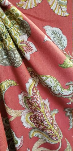 the fabric is very colorful and has many designs on it, like this one in red