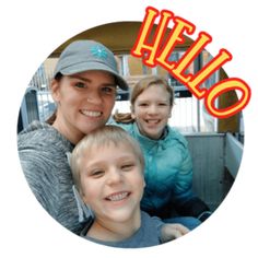 a woman and two children are smiling for the camera with an orange hello sign in the background