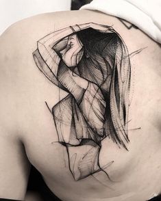 the back of a woman's shoulder is shown with lines and shapes on it